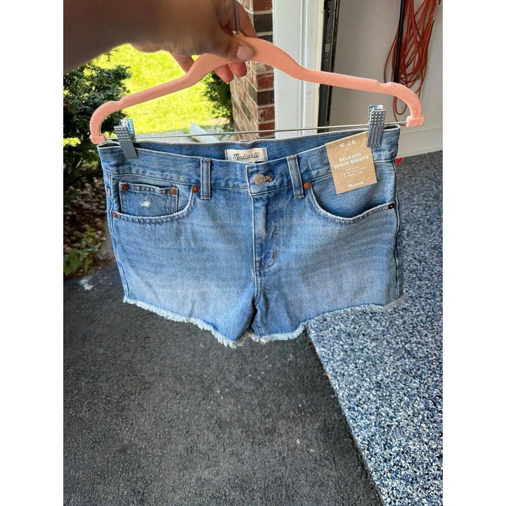 Madewell Relaxed Denim Shorts feature a light wash with a frayed raw hem 26 or 4